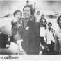 Black and white photograph of Indochinese refugees arriving in Iowa, 1979.
