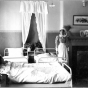 Nurse with patient in Fergus Falls State Hospital