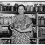 Woman with canned vegetables, part of Farm Security Administration program. 