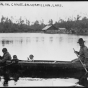 Black and white photograph of an Ojibwe family in canoe on Lake Vermilion, ca. 1905. 