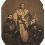 Black and white photo print of the Ho-Chunk (Winnebago) leader Baptiste Lasallier (center) with Indian Agent Charles H. Mix (right) and an Indian supply merchant from New York (left), 1857.