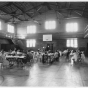 Black and white photograph of a sewing project at Phyllis Wheatley House, 1936.