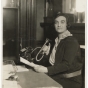 Black and white photograph of a woman in the office of the Jewish Family Welfare Association, Minneapolis, c.1925.