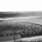 Black and white photograph of the the Dakota concentration camp on the river flats below Fort Snelling, c.1862–1863.