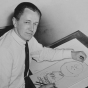 Charles Schulz with a drawing of Charlie Brown