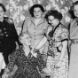 Black and white photograph of Mae Rideout being congratulated for being named “Woman of the Year,” 1954.