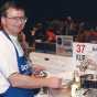 Color image of Bake-Off Winner Kurt Wait (Redwood City, CA) baking macadamia fudge torte. He was the first and only male grand prize winner, 1996. 