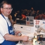 Color image of Bake-Off Winner Kurt Wait (Redwood City, CA) baking macadamia fudge torte. He was the first and only male grand prize winner, 1996. 