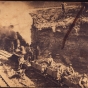 photograph of a train in a clay pit, filled with clay