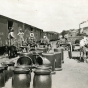 photograph showing clay sewer pipe sections next to a boxcar