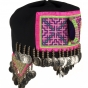 Color image of a Hmong girl’s hat in the traditional style. Made in St. Paul in 1989.