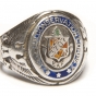 Color image of a Sterling silver Civilian Conservation Corps ring with CCC logo flanked by an eagle and shield on opposing ends. Logo is engraved with "3707/ and "EAF". Worn by Fred Fretheim of Company 3707, Two Harbors, MN, ca. 1936–1937. 