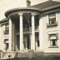 Colonial Hall (1900 3rd Avenue South, Anoka), date unknown. This was the home of Dr. Alanson Aldrich and Dr. Flora Aldrich. Alanson was an avid hunter and kept several hunting dogs in a kennel behind the house, two of which can be seen on the porch in this photograph. Photographer and date unknown. This photograph was found in the 1960s in the home of Era M. Smith, a friend of Dr. Flora Aldrich. Used with the permission of the Anoka County Historical Society.