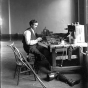 Black and white photograph of E. H. Erickson making artificial limbs, 1904.