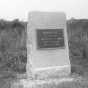 Photograph of a rectangular stone monument with metal plaque honoring the Fourth Minnesota regiment