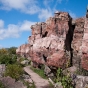 Color image of a Sioux Quartzite ridge and hiking trail at Pipestone National Monument, 2010. Photograph taken by flicker user Brian Jeffery Beggerly.Sioux Quartzite ridge and hiking trail at Pipestone National Monument, 2010. Photograph taken by flicker user Brian Jeffery Beggerly.