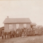 Photograph of Zoar public school (District #20) c.1895. Teacher Vena Abbott stands with her students outside the school building. Photograph Collection, Carver County Historical Society, Waconia.