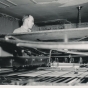 Black and white photograph of a Waconia Patriot employee uses a printing press. Date and photographer unknown.