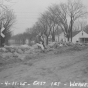 Black and white photograph of water surrounding new courthouse. Flood waters of 1965, Chaska