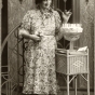 Black and white photograph of Susie Schmitt Hanson pictured at age eighty-five with a birthday cake, c.1945.