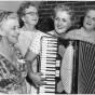 Photograph of Coya Knutson playing her accordion