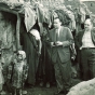 Black and white photograph of the executive director of the United Jewish Federation Council of St. Paul and the executive director of the Jewish Federation Council of Kansas City visit a home in Ourika, Morocco during a tour of conditions of Jews in North Africa, undated. 