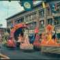Parade floats passing down a Minneapolis Street for Aquatennial's Grande Day Parade, 1960.