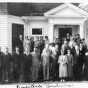Members and staff of the Minnesota Board of Control in Faribault, 1936. Fourteenth from the left in the bottom row is Mildred Thomson.