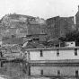 Black and white photograph of Red Wing's crowded riverfront with Barn Bluff in the background, c. 1910