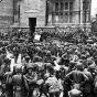 Black and white photograph of Thirty-fourth Division Infantrymen pausing to celebrate the taking of Bologna, April 1945.