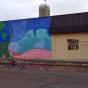 Color image of the exterior of the Minneapolis location of Comunidades Latinas Unidas en Servicio (CLUES), a nonprofit social service organization for Latinos, at 720 East Lake Street in Minneapolis, February 20, 2016. Photographed by Lizzie Ehrenhalt.