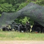 Crewmen from Ortonville’s C Battery, First Battalion, 151st Field Artillery