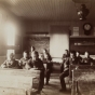 Black and white photograph of students inside a classroom at a Native American boarding school, c.1900.