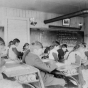 Black and white photograph of “intermediate” students inside a classroom at an Native American boarding school in Beaulieu, c.1900.
