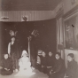 Black and white photograph of students at a Native American boarding school perform a Thanksgiving play, c.1900.