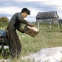 Jim Drift winnowing wild rice at Nett Lake