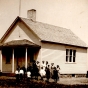 Black and white photograph of students in front of District 112 school in Mason Township, Murray County, 1913. 