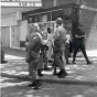 Black and white photograph of National Guardsmen patrolling Plymouth Avenue in North Minneapolis, July 1967.