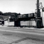 Black and white photograph of boarded-up storefronts on Plymouth Avenue in North Minneapolis, July 1967. Photographed by Twiggs.