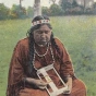 Colorized picture postcard featuring a Dakota woman making beadwork, c.1930.