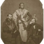 Black and white photo print of the Ho-Chunk (Winnebago) leader Baptiste Lasallier (center) with Indian Agent Charles H. Mix (right) and an Indian supply merchant from New York (left), 1857.