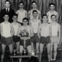 Black and white photograph of the Polars Club basketball team, sponsored by the Emanuel Cohen Center in North Minneapolis, 1935.