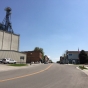 Photograph of tntrance to Harmony’s Main Street, grain elevator