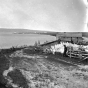 Black and white photograph of a view of La Pointe with Bayfield in the distance, 1875.