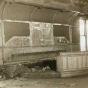 Black and white photograph of the Supreme Court chamber in the second capitol building, partially dismantled prior to building demolition, 1937. Photographed by the Minneapolis Tribune.