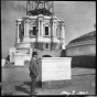 Cass Gilbert standing before partial State Capitol dome