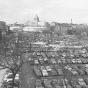 Black and white photograph of the Capitol approach, with Wabasha Street on the left, Cedar Street on the right, showing the site of the second state capitol as a parking lot, 1954.