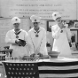 Black and white photograph of young bakers participating in a bread-making demonstration at the 1918 Minnesota State Fair.