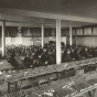 Black and white photograph of a class in corn judging, University of Minnesota, College of Agriculture, St. Paul, ca. 1910.