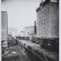 Black and white photograph of riverfront flour mills before the 1878 explosion.